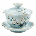 Taza gaiwan de porcelana 150 ml azul claro con flores y borde dorado
